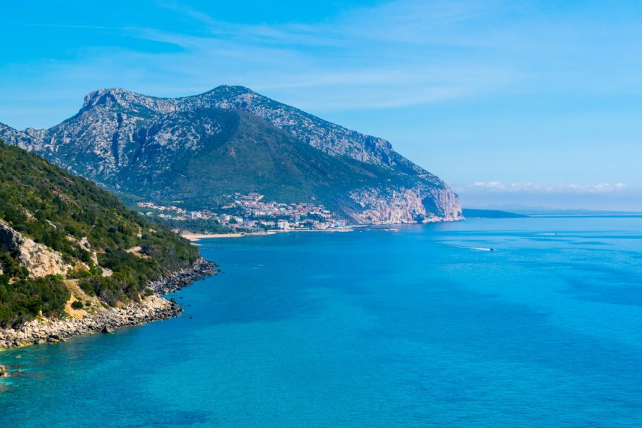Panoramic view of Cala Gonone bay with sea and mountains on Sardinia island, Italy