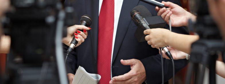 business meeting conference journalism microphones close up of conference meeting microphones and businessman