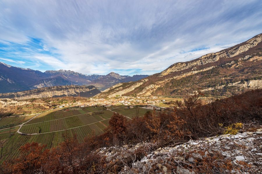 Aerial view of the small village of Nago-Torbole view from the mountain range of Monte Baldo (Monte Altissimo di Nago, Sentiero della Pace). Trento province, Trentino Alto Adige, Italy, Europe.