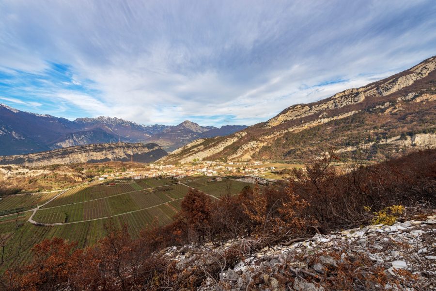Aerial view of the small village of Nago-Torbole view from the mountain range of Monte Baldo (Monte Altissimo di Nago, Sentiero della Pace). Trento province, Trentino Alto Adige, Italy, Europe.