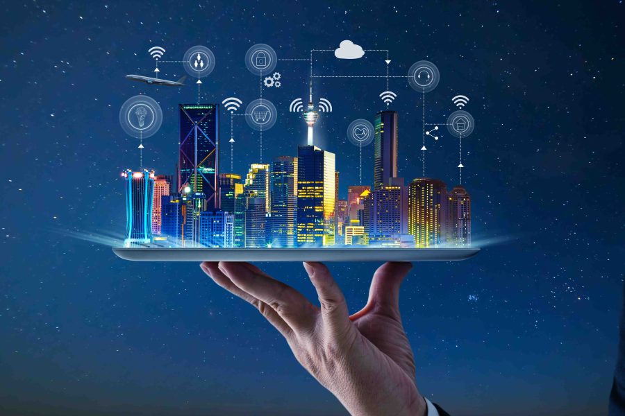 Waiter hand holding an empty digital tablet with Smart city with smart services and icons, internet of things, networks and augmented reality concept , night scene .