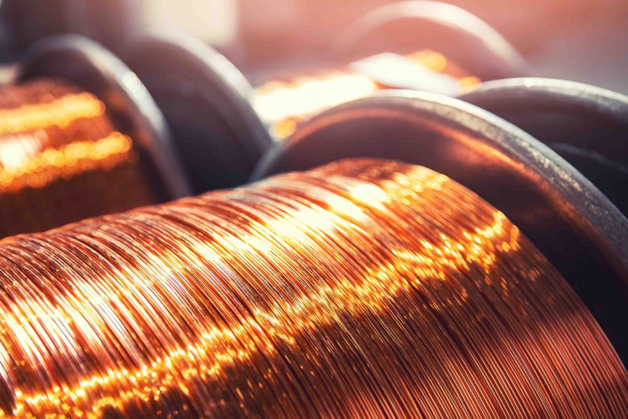 Macro texture copper cable rolled coil up on industry factory banner.