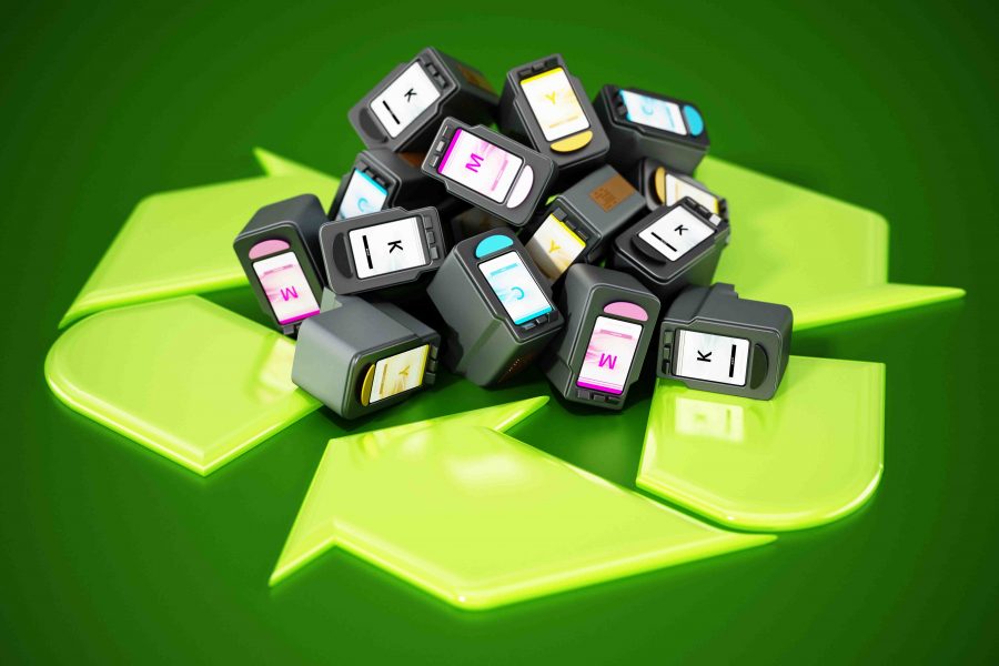 Used inkjet printer cartridges on recycle symbol. 3D illustration