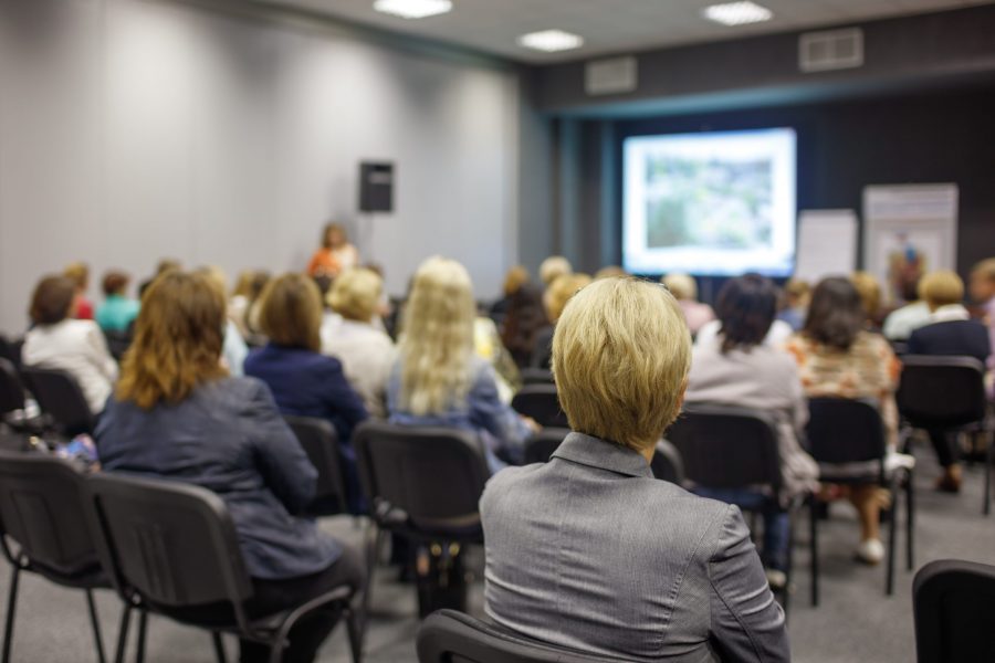 Business woman and people Listening on The Conference. Horizontal Image